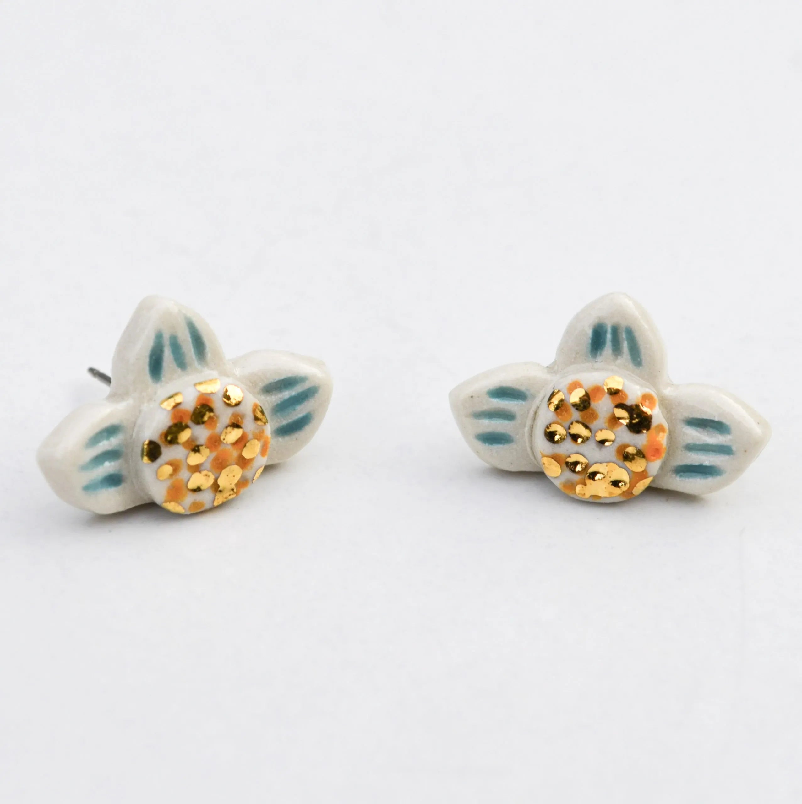 White Flower Studs with Blue Accents